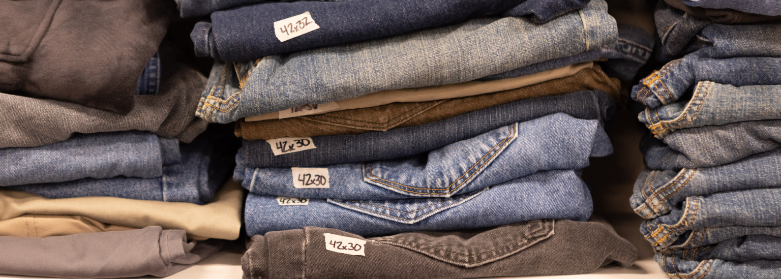 m3f-jeans-drive-campaign-header jeans stacked on a shelf