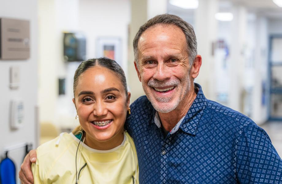 Anthony poses with his dentist, Dr. Leyva.