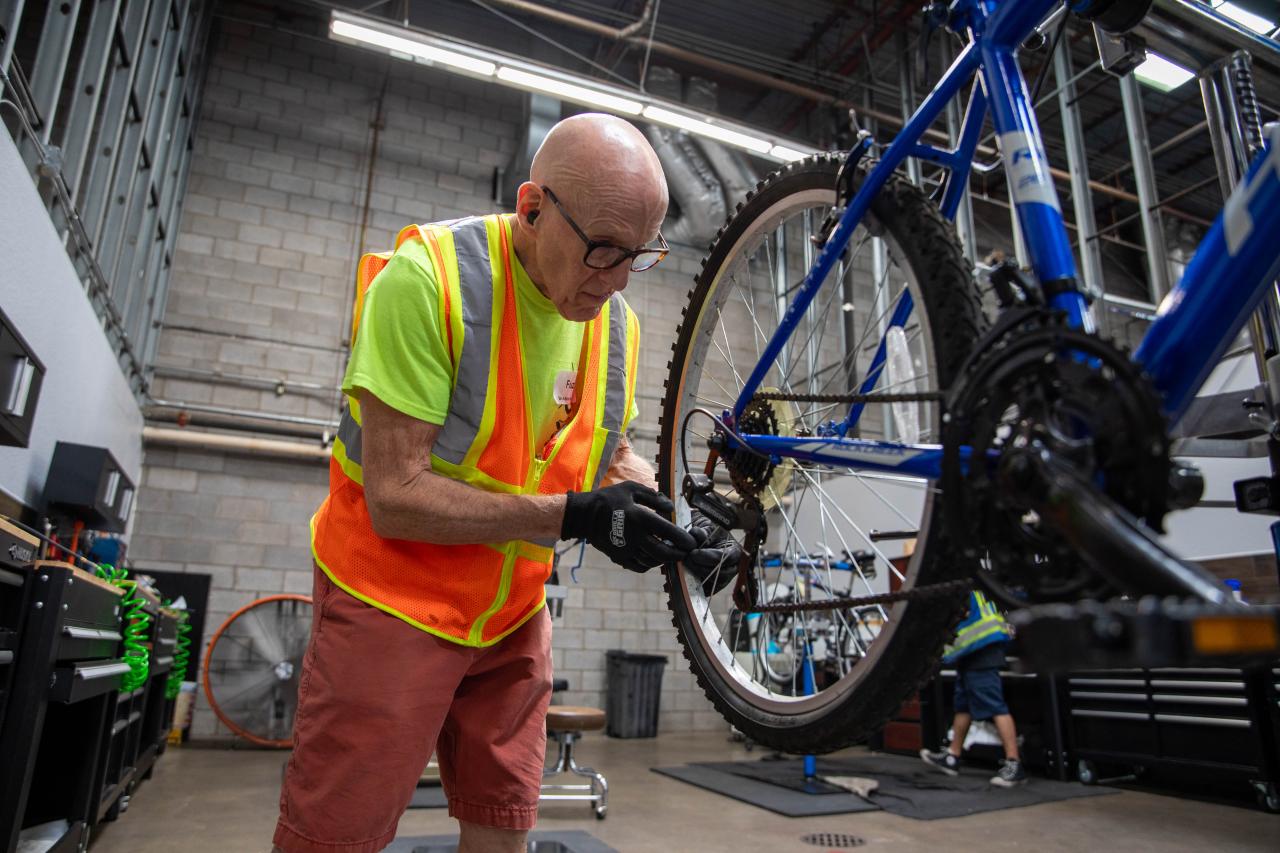 Resident fixing a bike