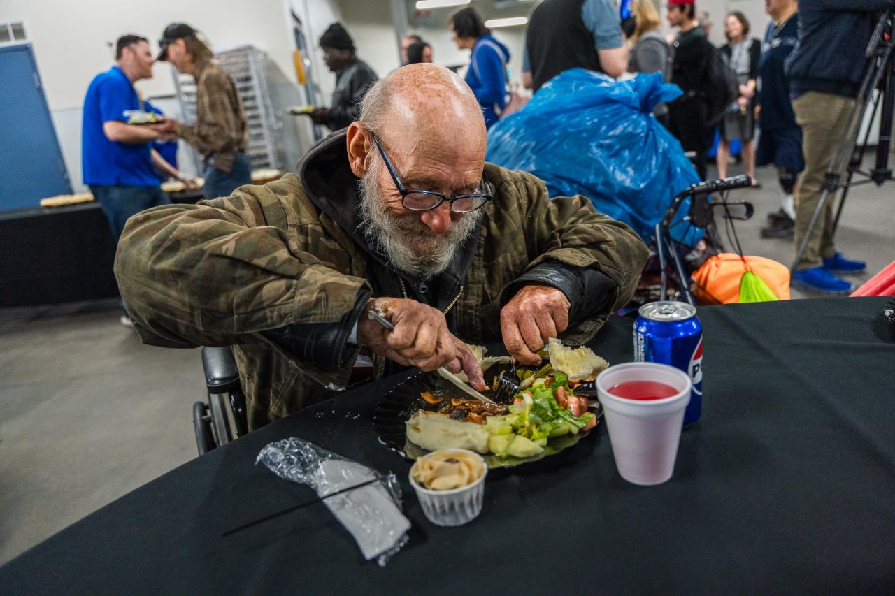 Guest happily eating steak