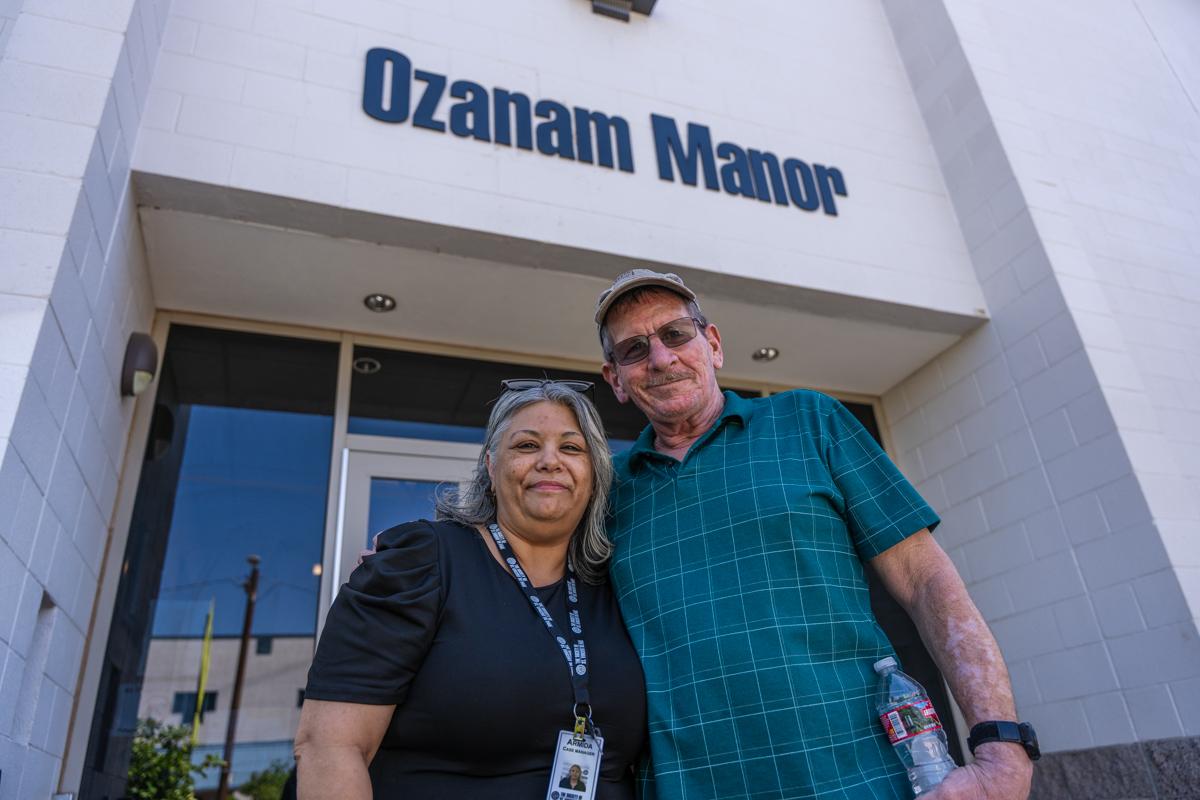 Christopher poses with his case manager, Armida.