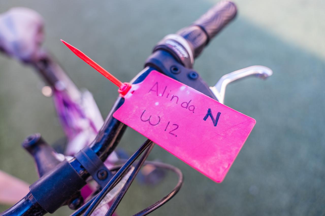 The tag on Alinda's bike identifies its owner.